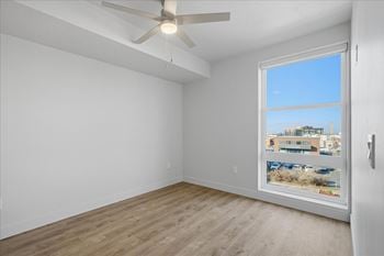 Room with window overlooking parking lot1